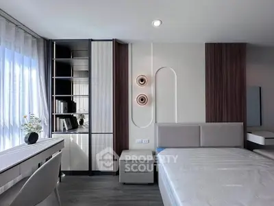 Modern bedroom with sleek design, featuring a stylish bed, built-in storage, and elegant lighting.