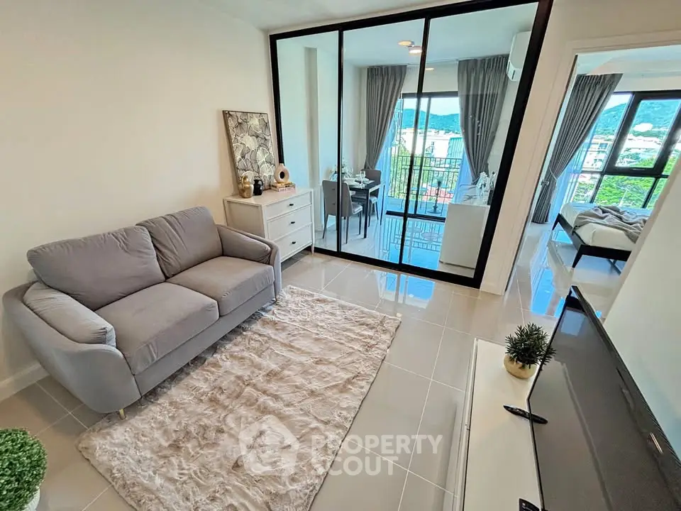 Modern living room with cozy sofa and balcony view in stylish apartment