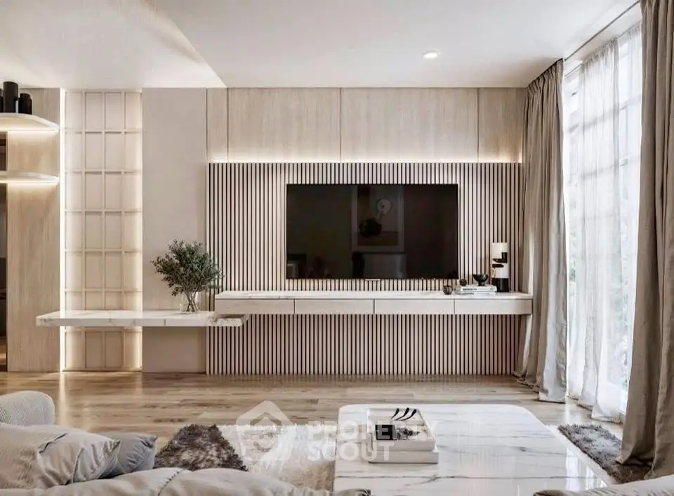 Luxurious modern living room with sleek TV unit and elegant decor