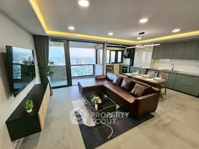 Luxurious open-layout living room with stunning city view and modern kitchen.