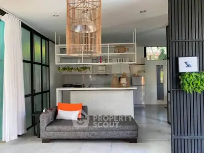 Modern open-plan living room with stylish kitchen and elegant decor