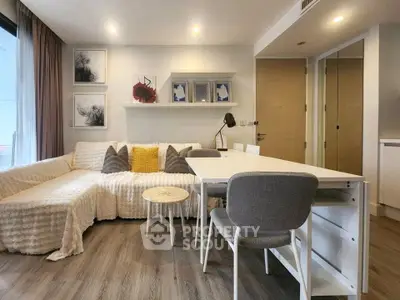 Modern living room with stylish decor and cozy seating area in a contemporary apartment.