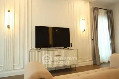 Elegant living room with modern TV setup and stylish lighting