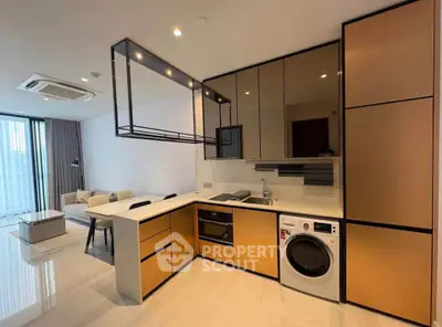 Modern open-plan kitchen and living room with sleek design and built-in appliances.