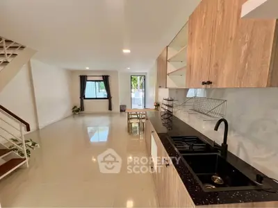 Spacious open-plan kitchen and living area with modern finishes and natural light.