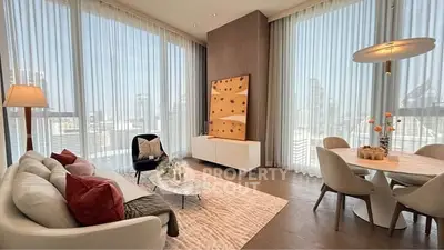 Luxurious modern living room with floor-to-ceiling windows and elegant decor