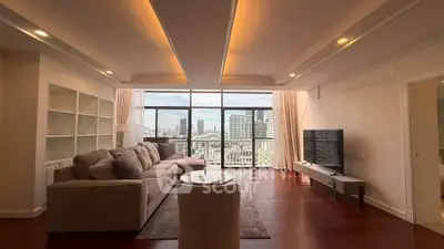 Spacious living room with stunning city view and modern furnishings