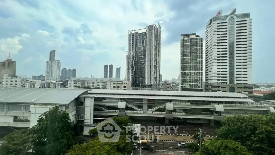 Stunning cityscape view with modern high-rise buildings and lush greenery.