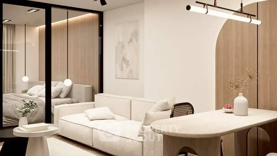 Modern living room with cozy sofa and stylish decor in open-concept apartment.