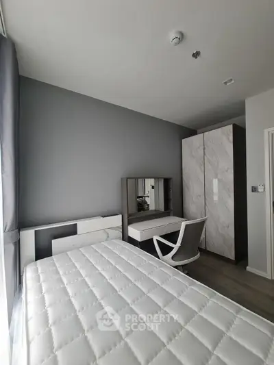 Modern bedroom with sleek furniture and natural light