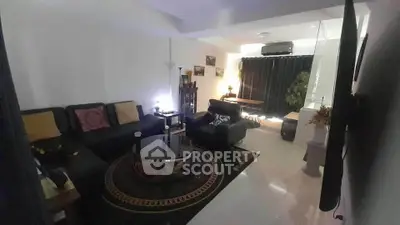 Spacious living room with modern decor and cozy seating area