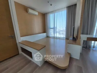 Spacious modern living room with elevated platform and large windows