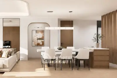 Modern open-plan living and dining area with elegant decor and natural light.