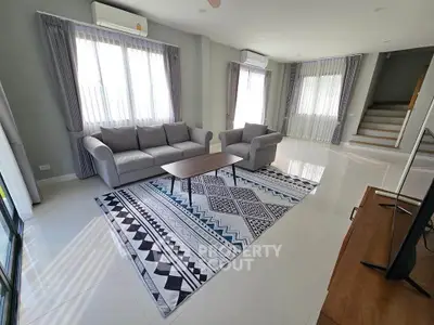 Spacious modern living room with stylish furniture and natural light