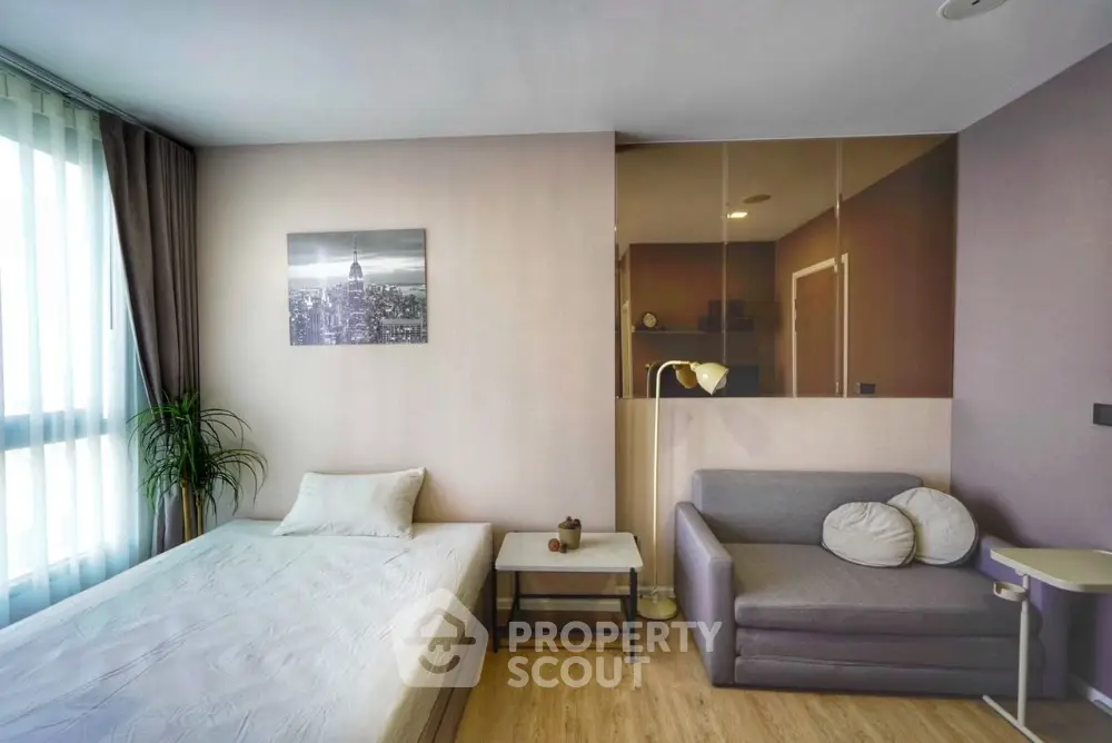 Modern bedroom with cozy decor and natural light in stylish apartment