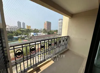 Spacious balcony with city view, perfect for relaxation and enjoying the skyline.