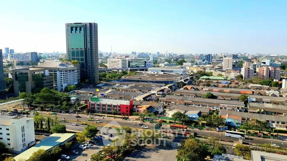 Stunning aerial view of urban landscape with high-rise buildings and bustling streets, perfect for real estate investment.
