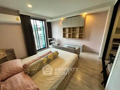 Modern bedroom with balcony access and stylish decor