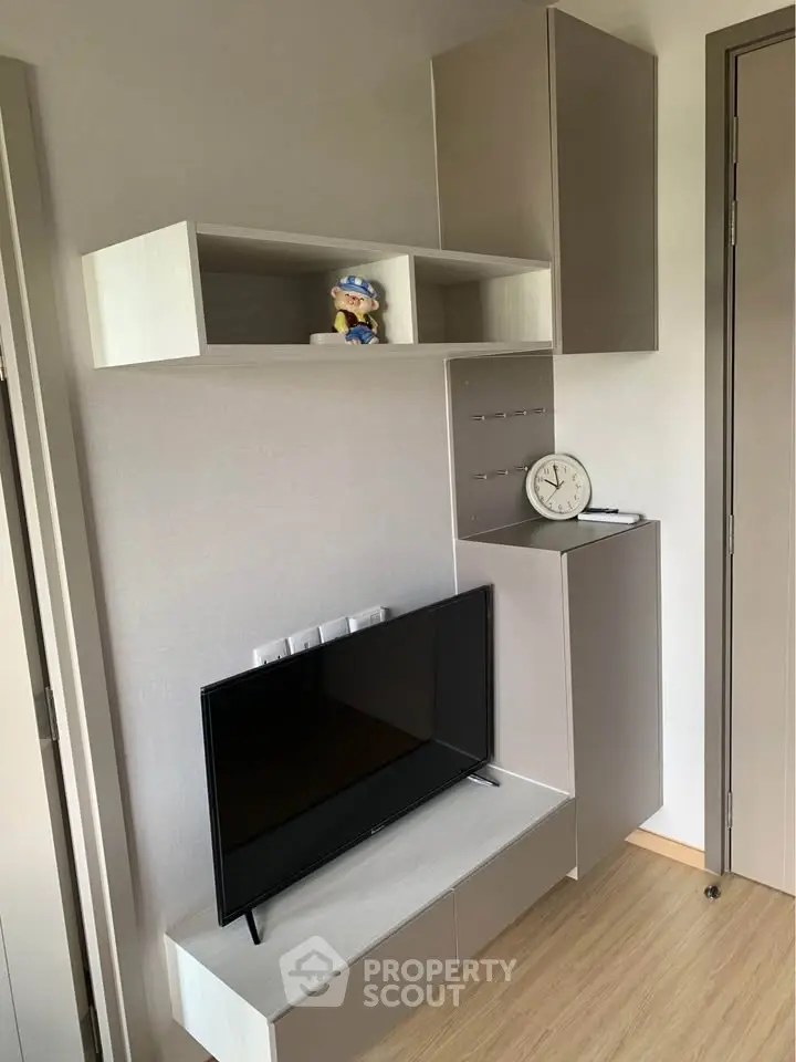 Modern living room with sleek TV unit and stylish storage cabinets
