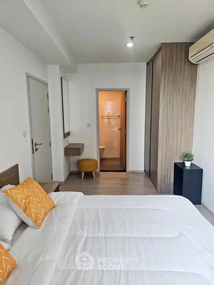 Modern bedroom with ensuite bathroom and stylish decor