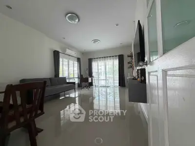 Spacious modern living room with sleek design and ample natural light