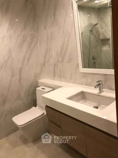 Modern bathroom with sleek fixtures and elegant marble walls