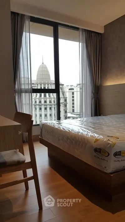 Modern bedroom with city view and stylish furnishings