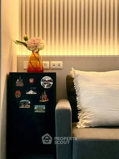 Cozy living room corner with stylish lighting and decorative accents