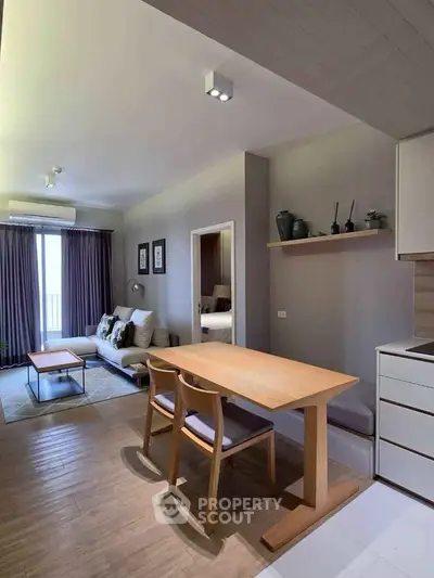 Modern open-plan living room with dining area and stylish decor