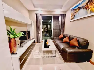 Modern living room with sleek furniture and stylish decor in a cozy apartment setting.