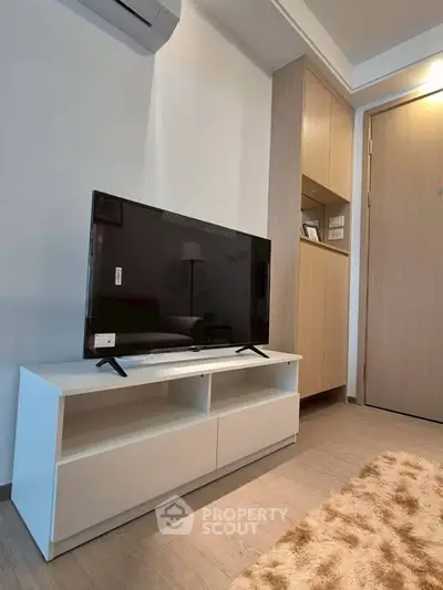 Modern living room with sleek TV stand and cozy decor