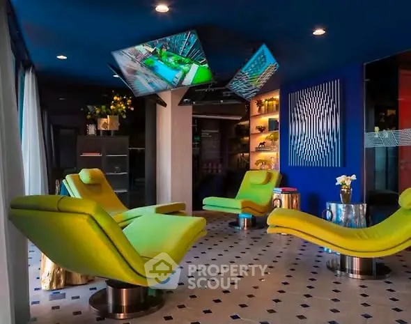 Luxurious modern living room with vibrant green chairs and stylish decor