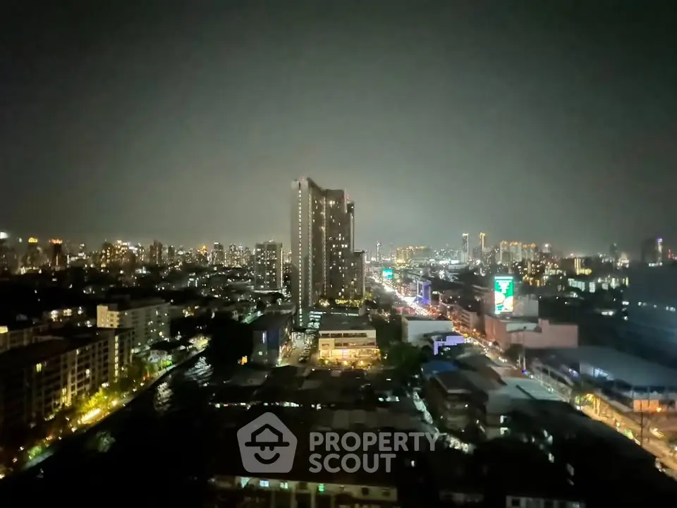 Stunning cityscape night view with illuminated skyline and high-rise buildings.
