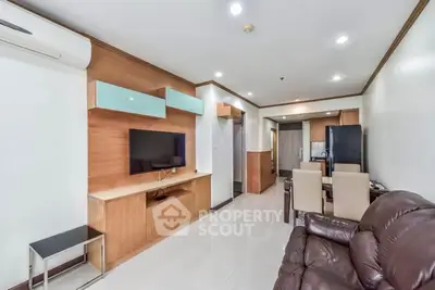 Modern living room with sleek furniture and open layout in a stylish apartment.