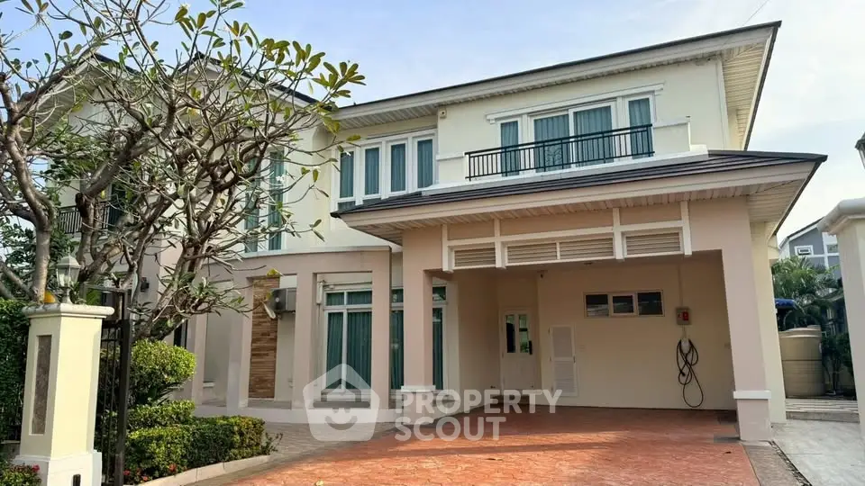 Elegant two-story house with spacious driveway and lush garden