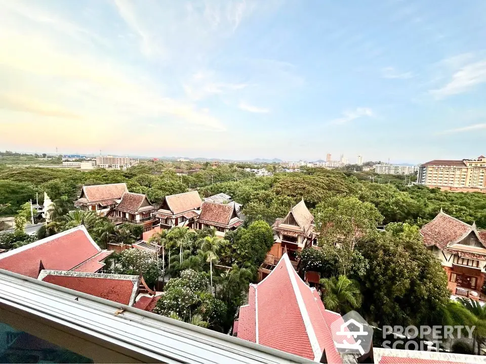 Scenic view of traditional-style villas surrounded by lush greenery and expansive skyline.