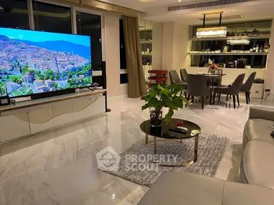 Luxurious modern living room with marble floors, large TV, and elegant dining area, perfect for entertaining.