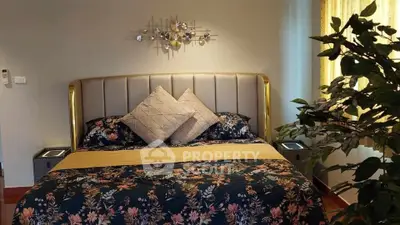 Luxurious bedroom with elegant decor and plush bedding, perfect for relaxation and comfort.