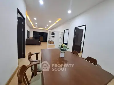 Spacious modern living room with elegant dining area and stylish lighting