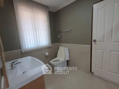 Spacious bathroom with modern fixtures and natural light