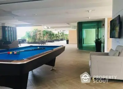 Luxurious rooftop with pool table and seating area, perfect for entertainment and relaxation.