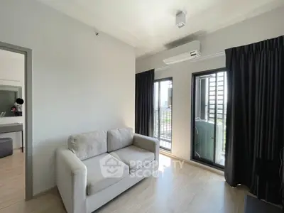 Modern living room with cozy sofa and balcony view in a stylish apartment