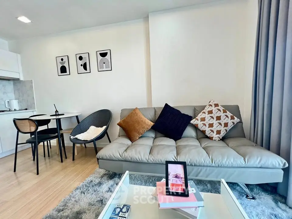 Modern living room with stylish decor and cozy seating area in a contemporary apartment.