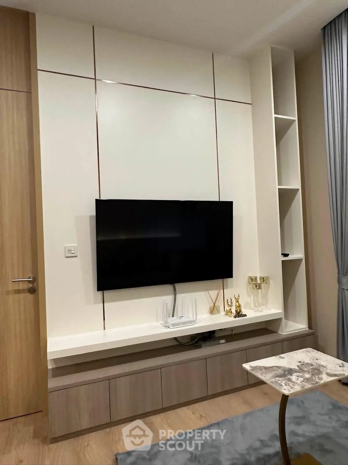 Modern living room with sleek TV setup and stylish decor