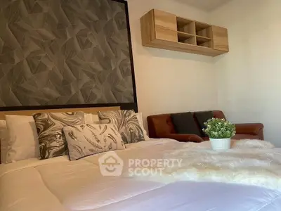 Cozy bedroom with stylish decor and modern furniture, perfect for relaxation and comfort.