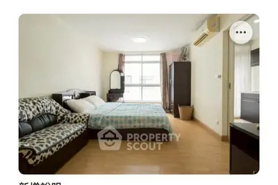 Spacious bedroom with modern decor and natural light