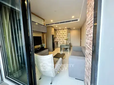 Modern living room with stylish decor and open kitchen layout in a contemporary apartment.