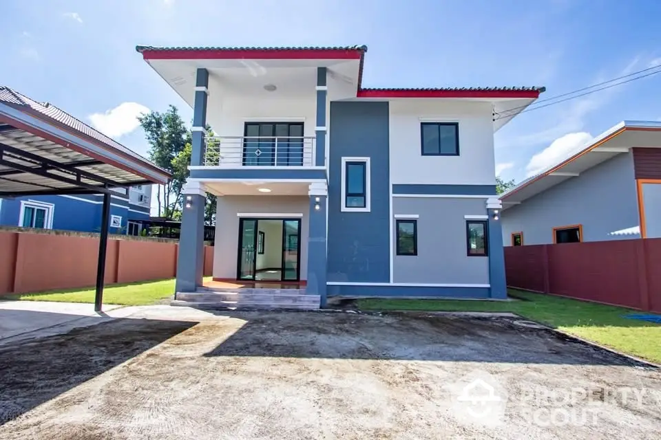 Modern two-story house with spacious driveway and contemporary design