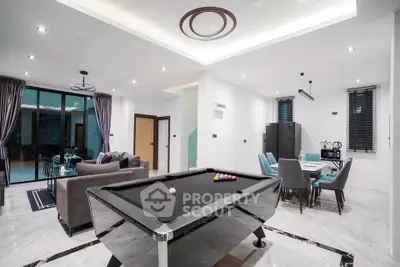 Luxurious modern living room with pool table and elegant dining area