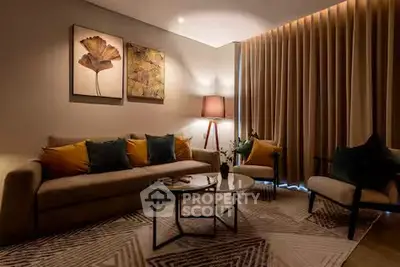 Elegant living room with cozy sofa, stylish decor, and warm lighting